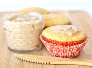 Cornbread muffin topped with flavored butter.