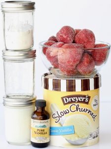 Strawberry Julius ingredients including ice cream, vanilla, and frozen strawberries.