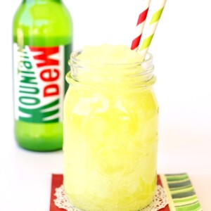 Mountain Dew Slush in a jar with paper straws.
