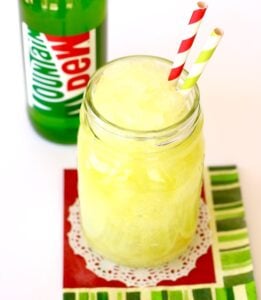 Straws in a jar of Mountain Dew Slushie.