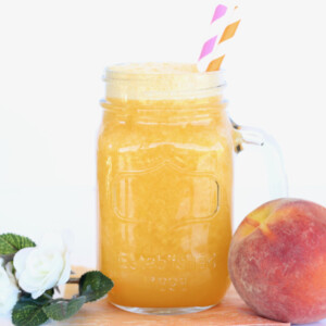 Peach Party Punch with two straws.