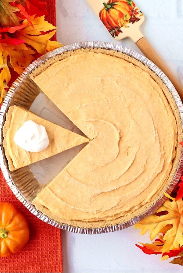 No-Bake Pumpkin Pie with graham cracker crust, cut with one slice of pie.