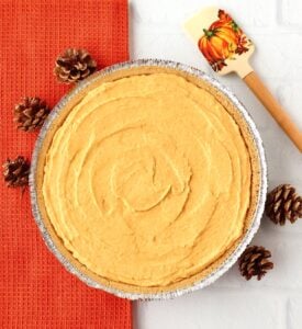 No-bake pumpkin pie in graham cracker pie crust with pinecones.