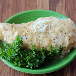 Caesar chicken on a green plate.