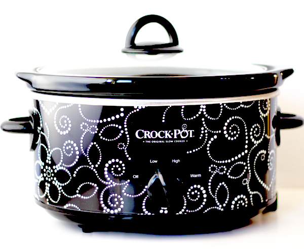 Black and white Crockpot with a lid.