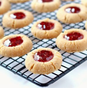 Peanut Butter and Jelly Cookies on a black cooking rack.