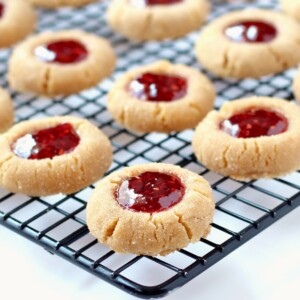 Peanut Butter and Jelly Cookies on a wire rack.