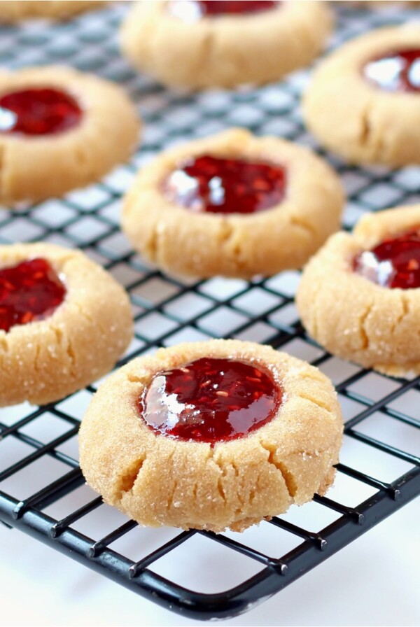 Peanut Butter and Jelly Cookies on a wire rack.