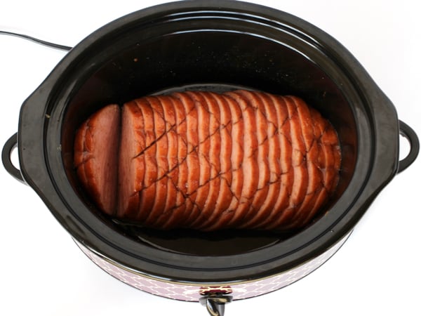 Sliced ham in a slow cooker.
