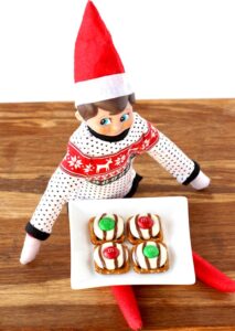 Christmas Pretzel Treats on a plate with an elf.