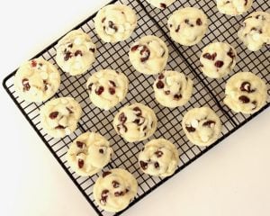 Cranberry White Chocolate cookies on a wire rack.