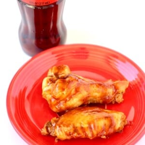 BBQ Coca Cola Wings on a red plate.