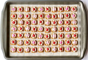 Red and pink M&Ms on pretzel hugs.
