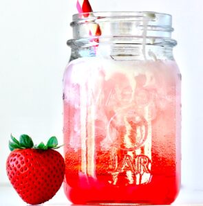 Strawberry Italian soda in mason jar.