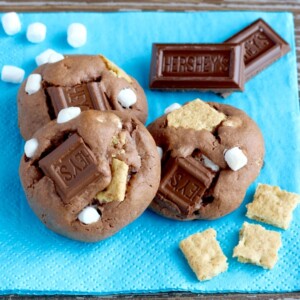 Baked S'mores cookies on a blue napkin.