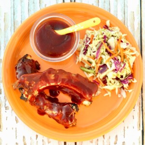 BBQ Ribs on an orange plate.