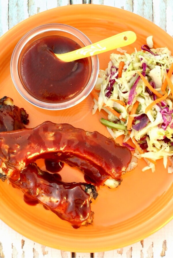 BBQ Ribs on an orange plate.