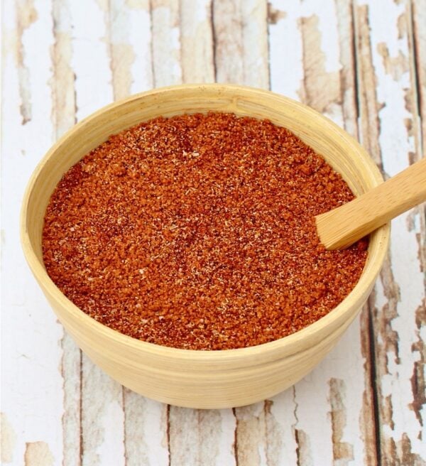 Bowl of barbecue rub with a spoon.