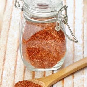 Barbecue rub in a jar and on a spoon.