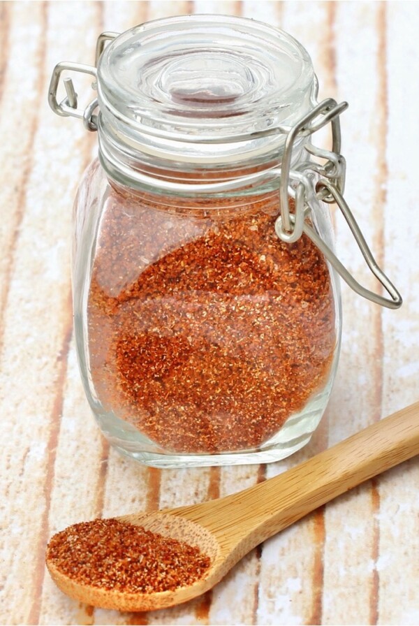 Barbecue rub in a jar and on a spoon.