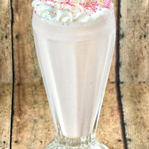 Strawberry Milkshake in a tall glass.