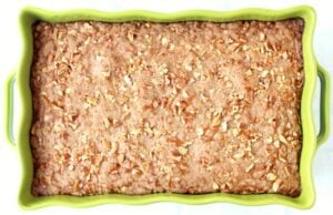 Pumpkin Dump Cake in a green baking dish.
