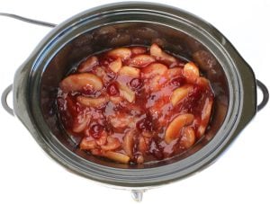 Fruit mixture in a slow cooker.