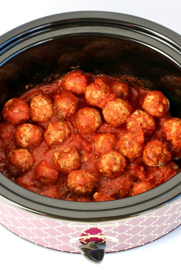 Cooked Italian Meatballs with sauce in crockpot.