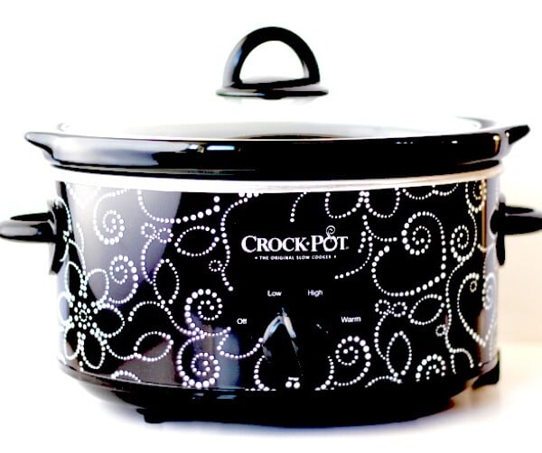 Black and white Crockpot with lid.