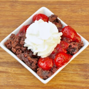 White bowl of Chocolate Cherry Dump Cake.