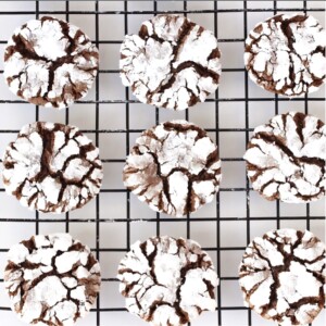 Wire rack with Chocolate Crinkle Cookies.