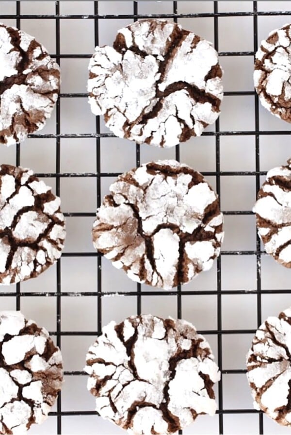 Wire rack with Chocolate Crinkle Cookies.