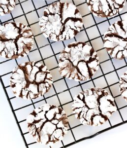 Chocolate Crinkles Cookies set on a wire rack.