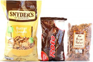 Square pretzels, pecan halves, and Rolo.