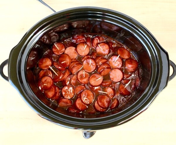 Sausage in sauce in a slow cooker.