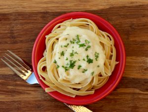 Easy Alfredo Sauce Recipe that just takes 5 Ingredients from TheFrugalGirls.com