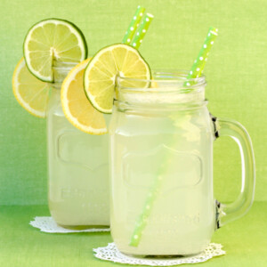 Lemon punch in mason jars with lemon and lime.