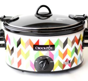Colorful Crockpot with a lid.