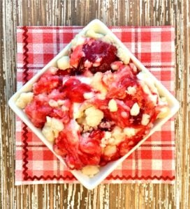 Bowl of Strawberry Cheesecake Dump Cake.
