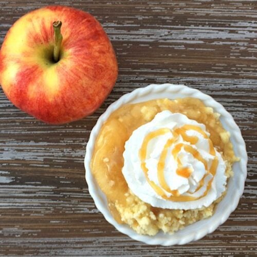Apple Dump Cake topped with whipped cream.