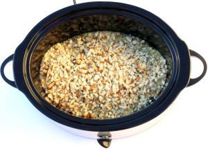 Stuffing over chicken in a slow cooker.
