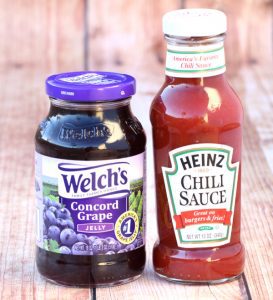 Jars of chili sauce and grape jelly.