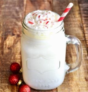 White hot chocolate in a jar with a straw.