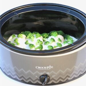 Cooked chicken broccoli alfredo in slow cooker.
