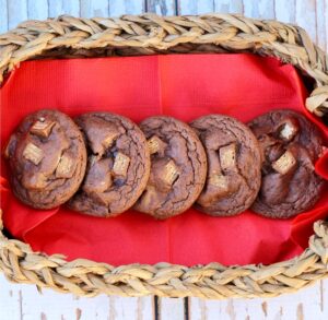 Chocolate Kit Kat cookies lined up on a napkin in a basket.