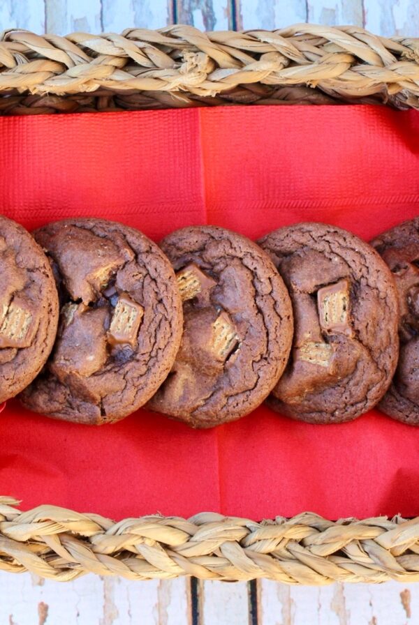 Chocolate Kit Kat cookies lined up on a napkin in a basket.