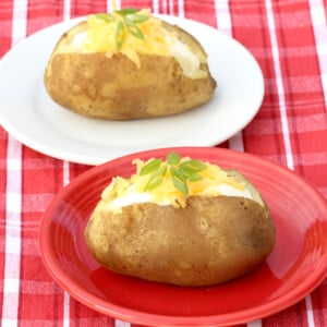 Two small plates with baked potatoes.