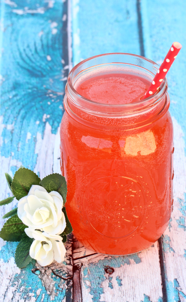 Fruit Punch in mason jar with straw.