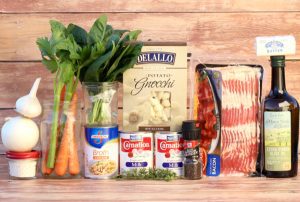 Soup ingredients including bacon, chicken broth, and pepper.