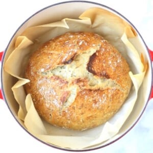 Loaf of rosemary bread in a Dutch oven.
